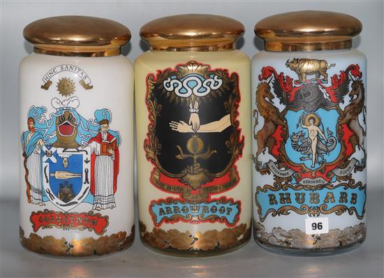 Three decorative glass storage jars